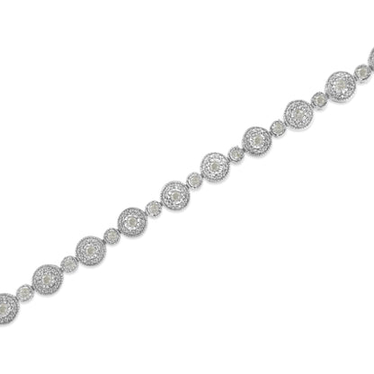 Diagonal close-up of a white metal bracelet featuring round white gemstones in a miracle setting with alternating larger and smaller circular links.