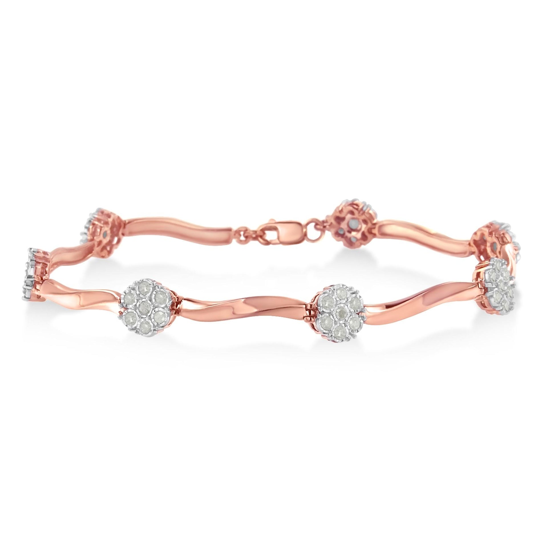 Rose metal bracelet with round white gemstones in prong settings, shown in a side angle view.