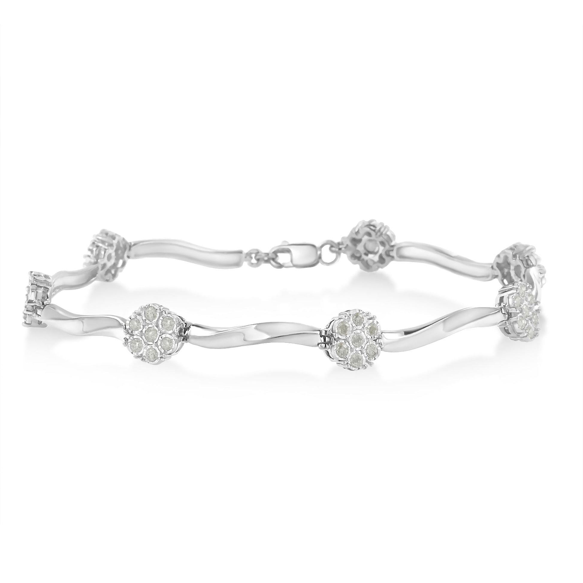 White metal bracelet with round white gemstones in miracle settings, displayed in a horizontal side view.