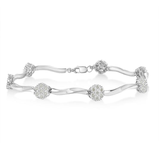 White metal bracelet with round white gemstones in miracle settings, displayed in a horizontal side view.