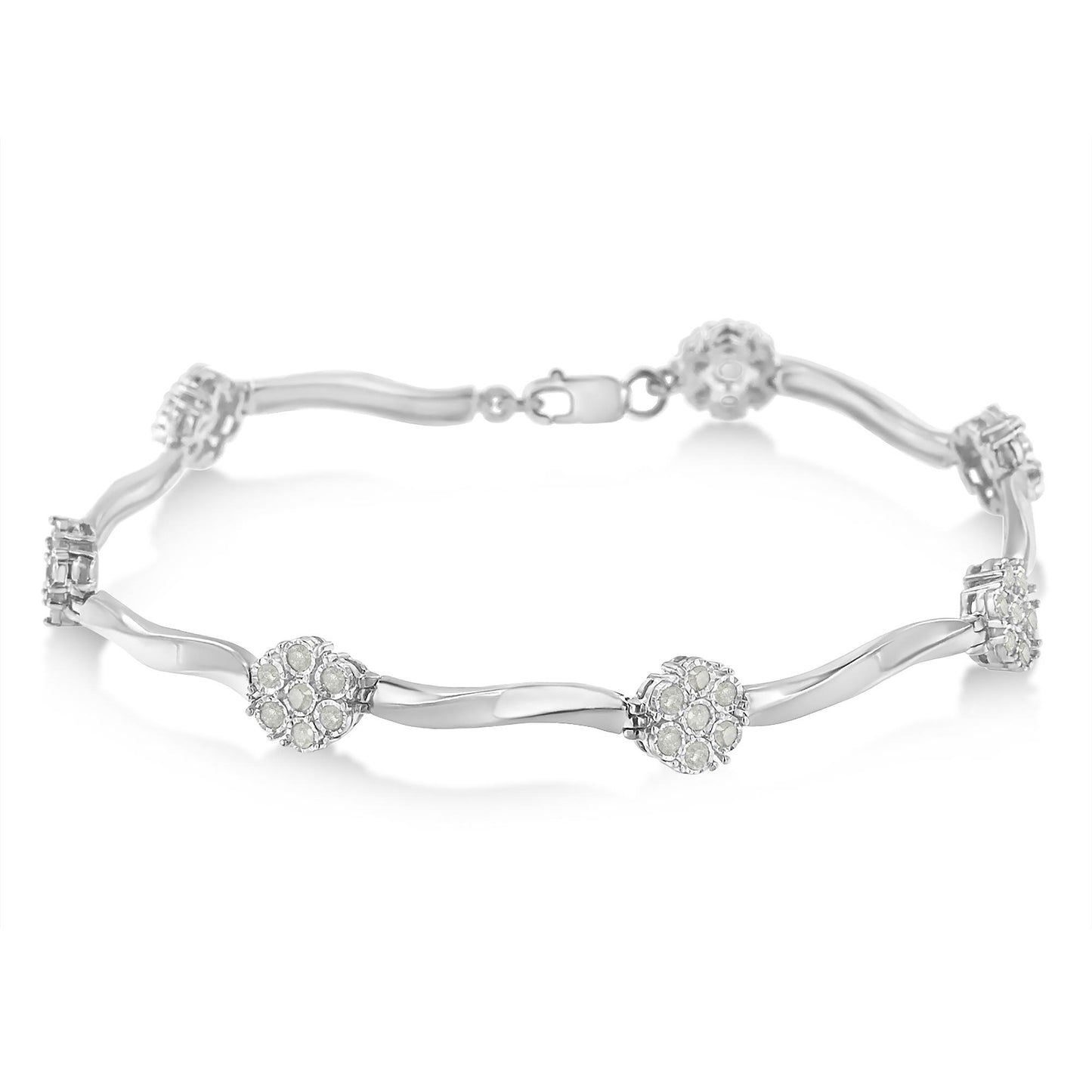 White metal bracelet with round white gemstones in miracle setting, shown in a close-up angled shot on a white background.