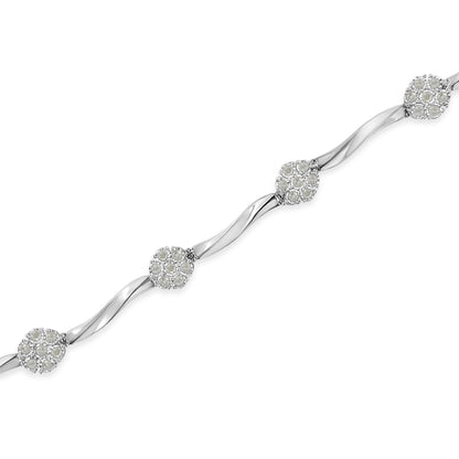 White metal bracelet with twisted links and clusters of round white gemstones in miracle setting, shown from a top-down angle.