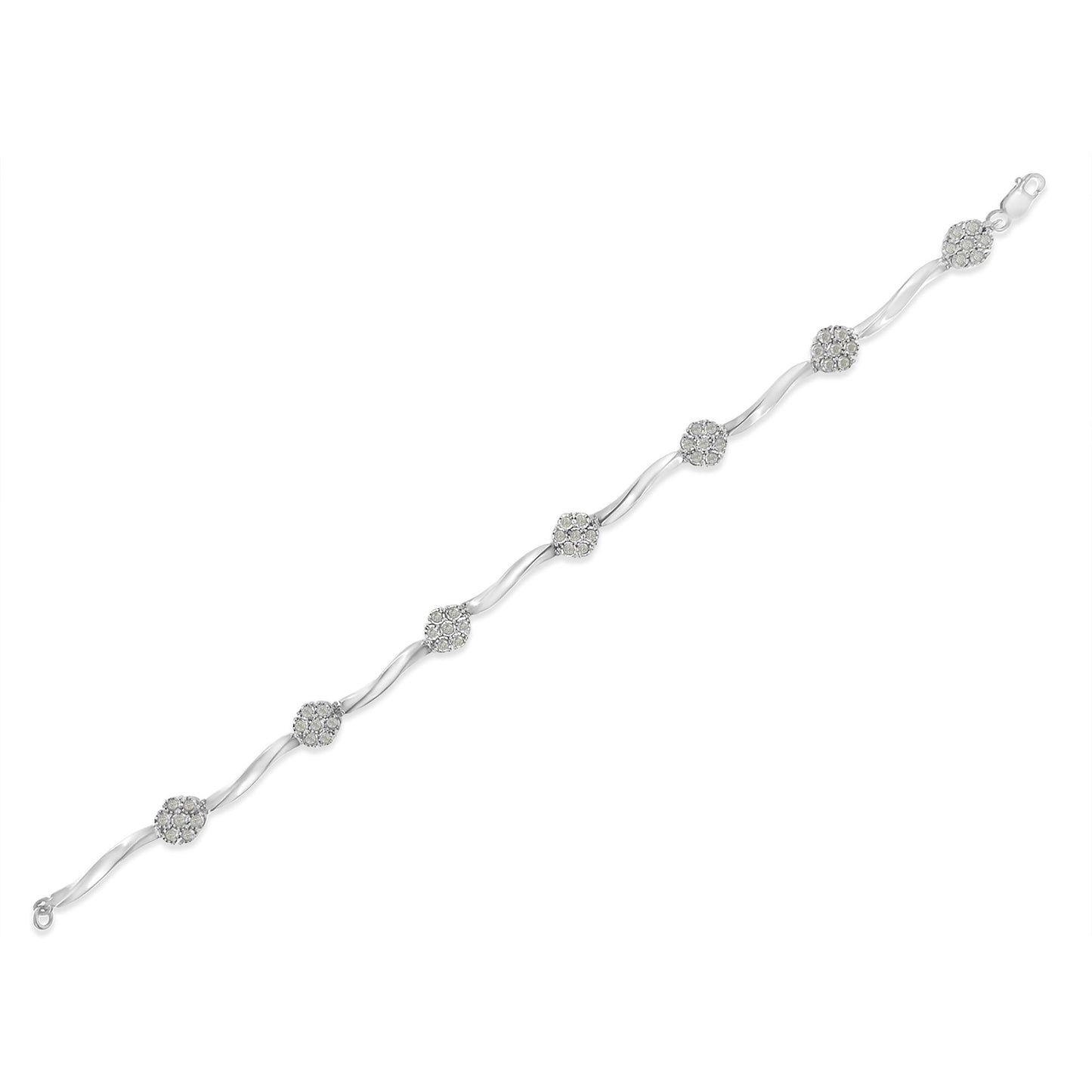 White metal bracelet with alternating curved links and round clusters of small white gemstones, shown laid flat in a top-down angled view.