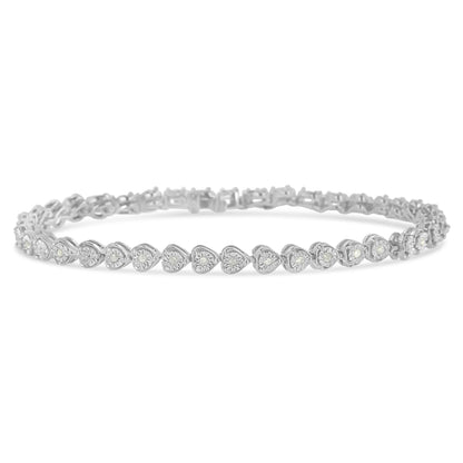 White metal bracelet with heart-shaped links each set with a round white gemstone in a miracle setting, shown in a close-up frontal angle.