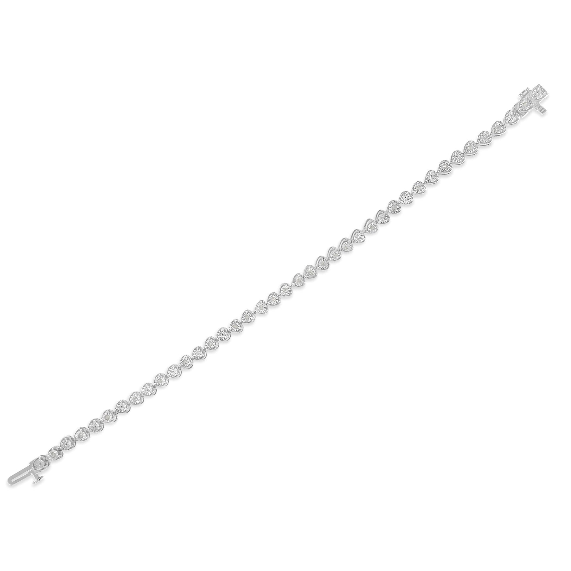 Diagonal top-down view of a white bracelet featuring a row of round-shaped white gemstones in a miracle setting.