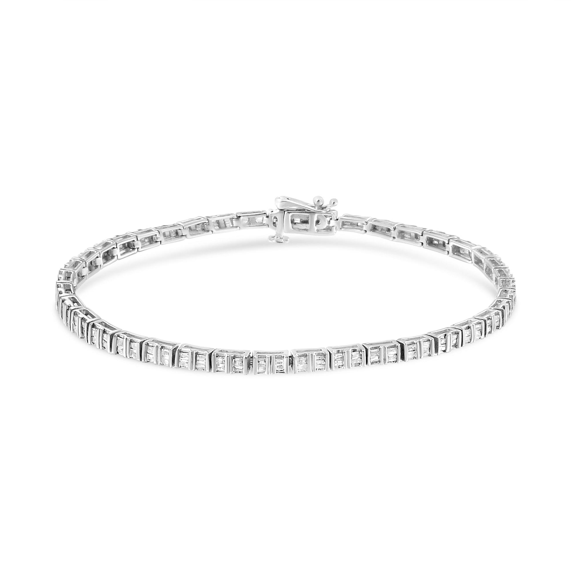 White metal bracelet with baguette-shaped white gemstones in a channel setting, shown from a slightly elevated front angle.