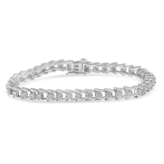 White metal bracelet with round white gemstones in prong settings, shown in a close-up side angle.
