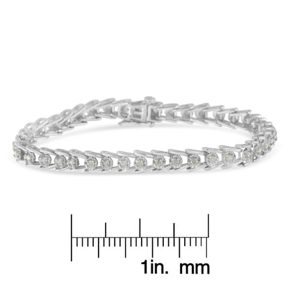 White metal bracelet with round prong-set white gemstones, shown in a front angled view, placed above a ruler for size reference.
