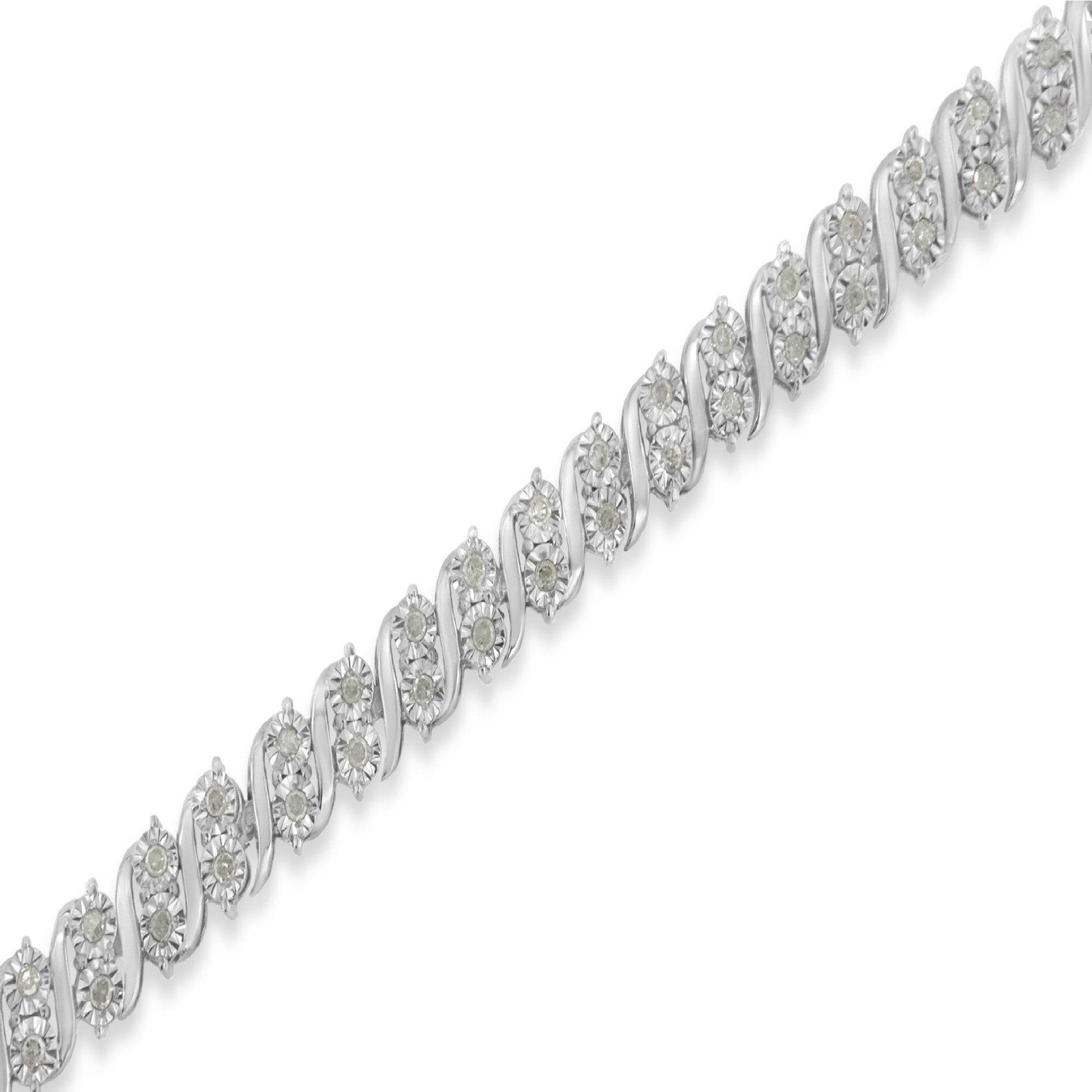 Diagonal close-up of a white metal bracelet featuring round white gemstones in a miracle setting.