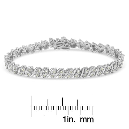 White metal bracelet with round white gemstones in a miracle setting, shown from a side angle on a ruler for size reference.