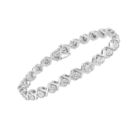 White metal bracelet with round white gemstones in a crisscross pattern, shown at an angled top view.