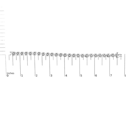 White metal bracelet with round white gemstones in miracle settings, displayed flat on a ruler for size reference, shot from the front.