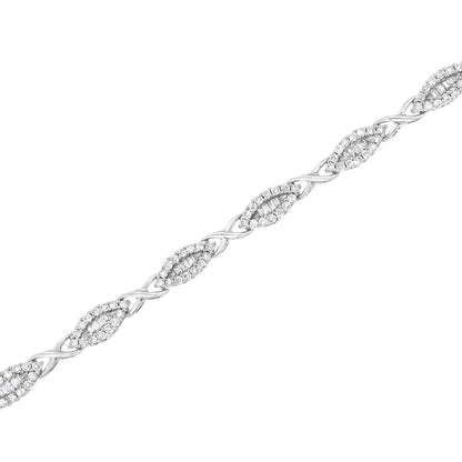 White metal bracelet with alternating marquise-shaped links featuring round gemstone pavé settings surrounding rows of baguette-shaped gemstones in channel settings, shown in a diagonal close-up view.