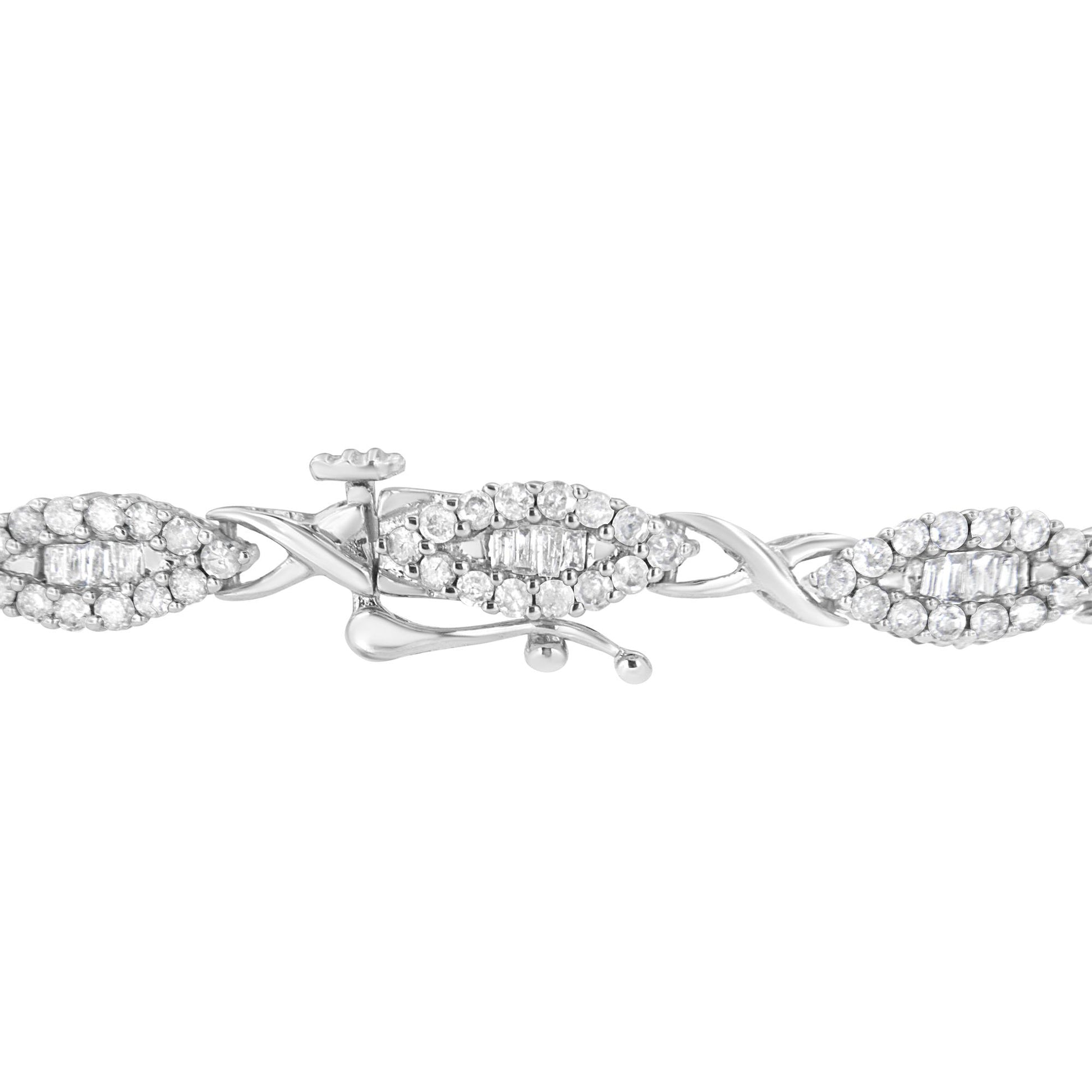 Close-up side angle of a white metal bracelet featuring oval links with round white gemstones in pave setting surrounding baguette white gemstones in channel setting, shown against a white background.