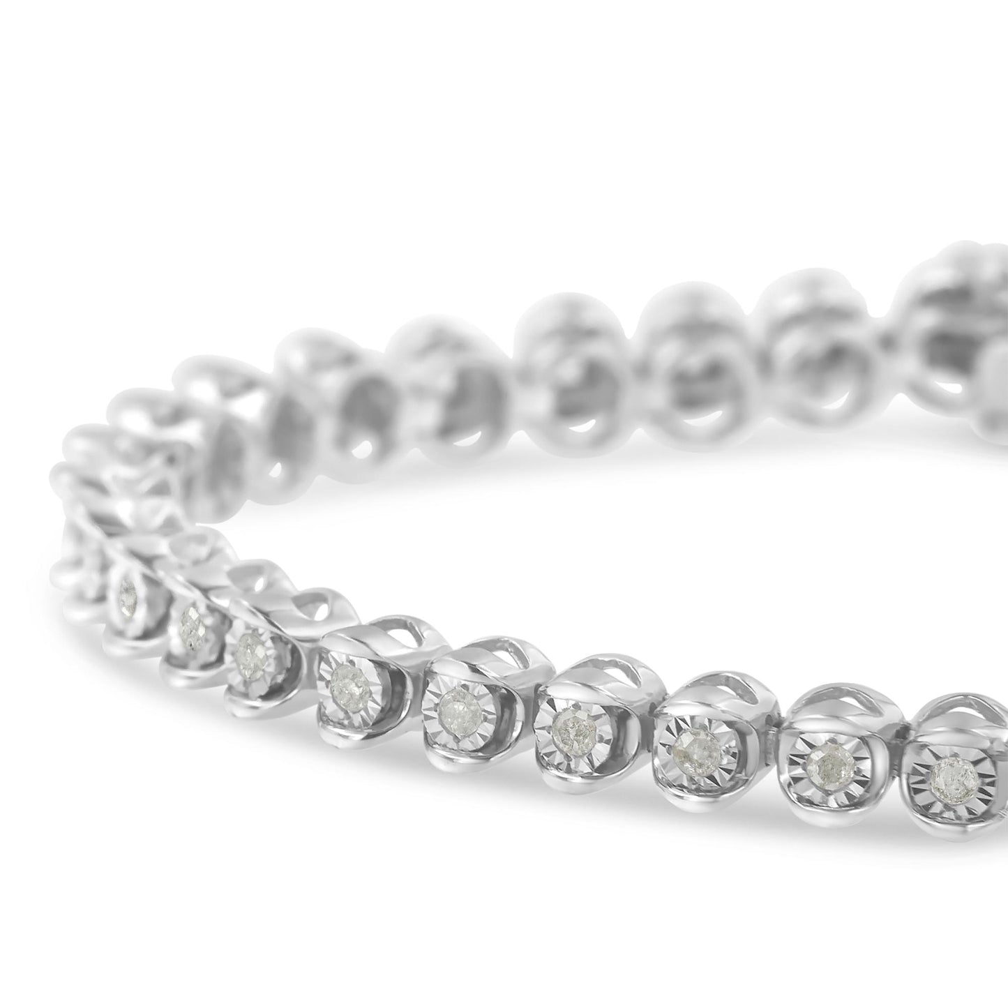 Close-up angled view of a white metal bracelet featuring round white gemstones in a miracle setting.