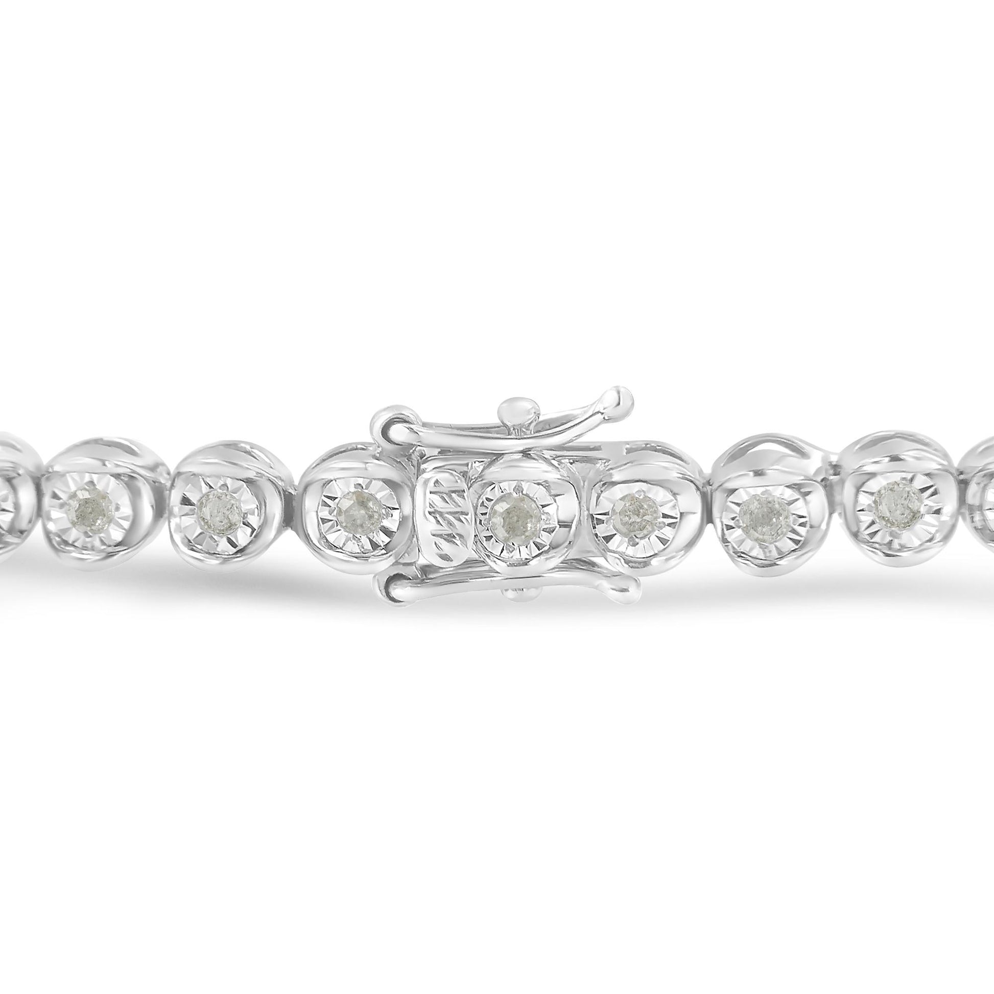 Close-up front angle of a white bracelet with round white gemstones set in a miracle setting, showing the clasp detail.
