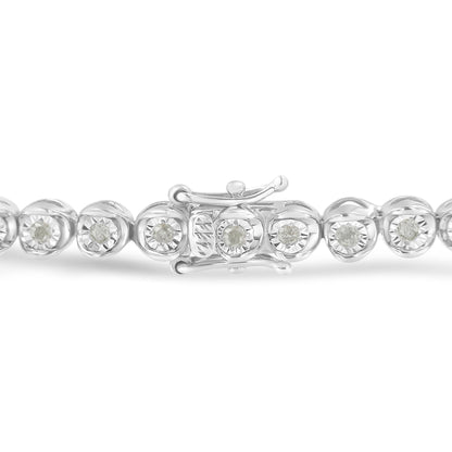 Close-up front angle of a white bracelet with round white gemstones set in a miracle setting, showing the clasp detail.