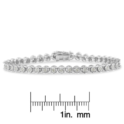 White metal bracelet with round white gemstones in a miracle setting, shown from a front angle on a ruler for size reference.