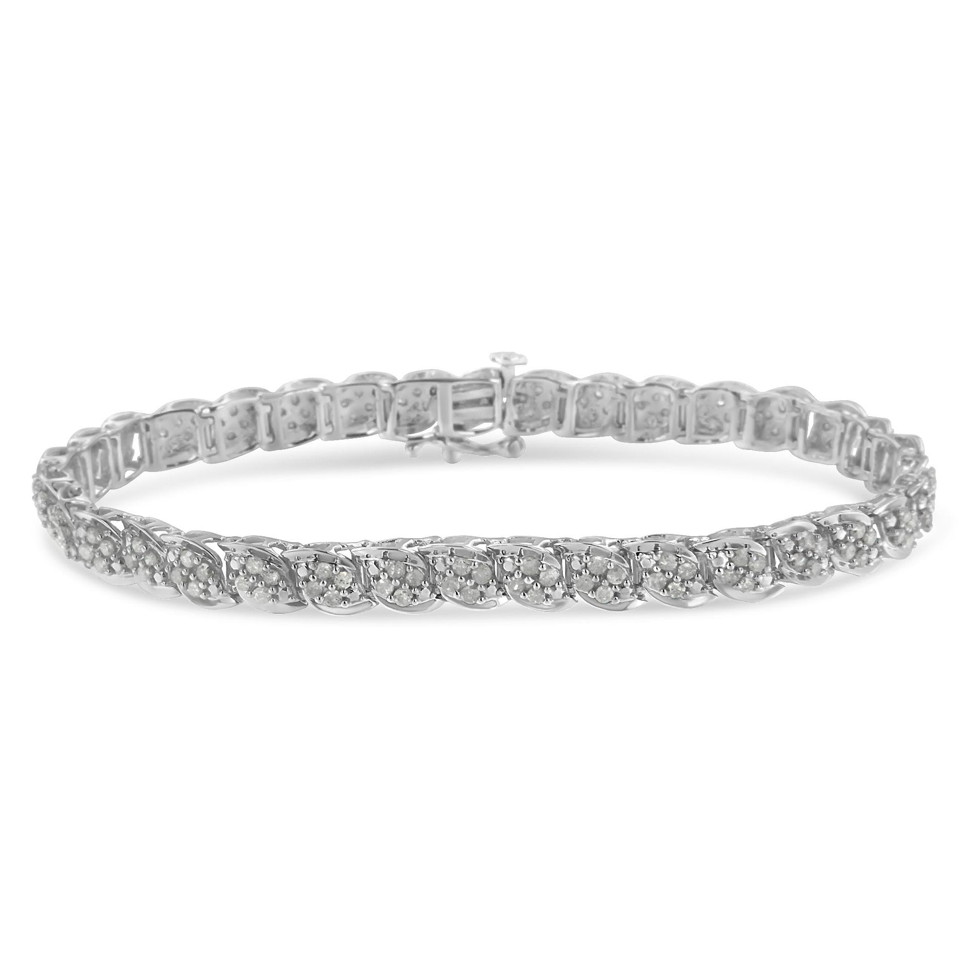 White metal bracelet with a twisted design featuring round white gemstones in prong settings, shown in a close-up front angle.