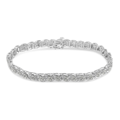 White metal bracelet with round white gemstones in prong settings, shown from a slightly elevated front angle.