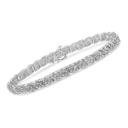 White metal bracelet with alternating linked sections, each set with round white gemstones in prong settings, shown at an angled close-up view.