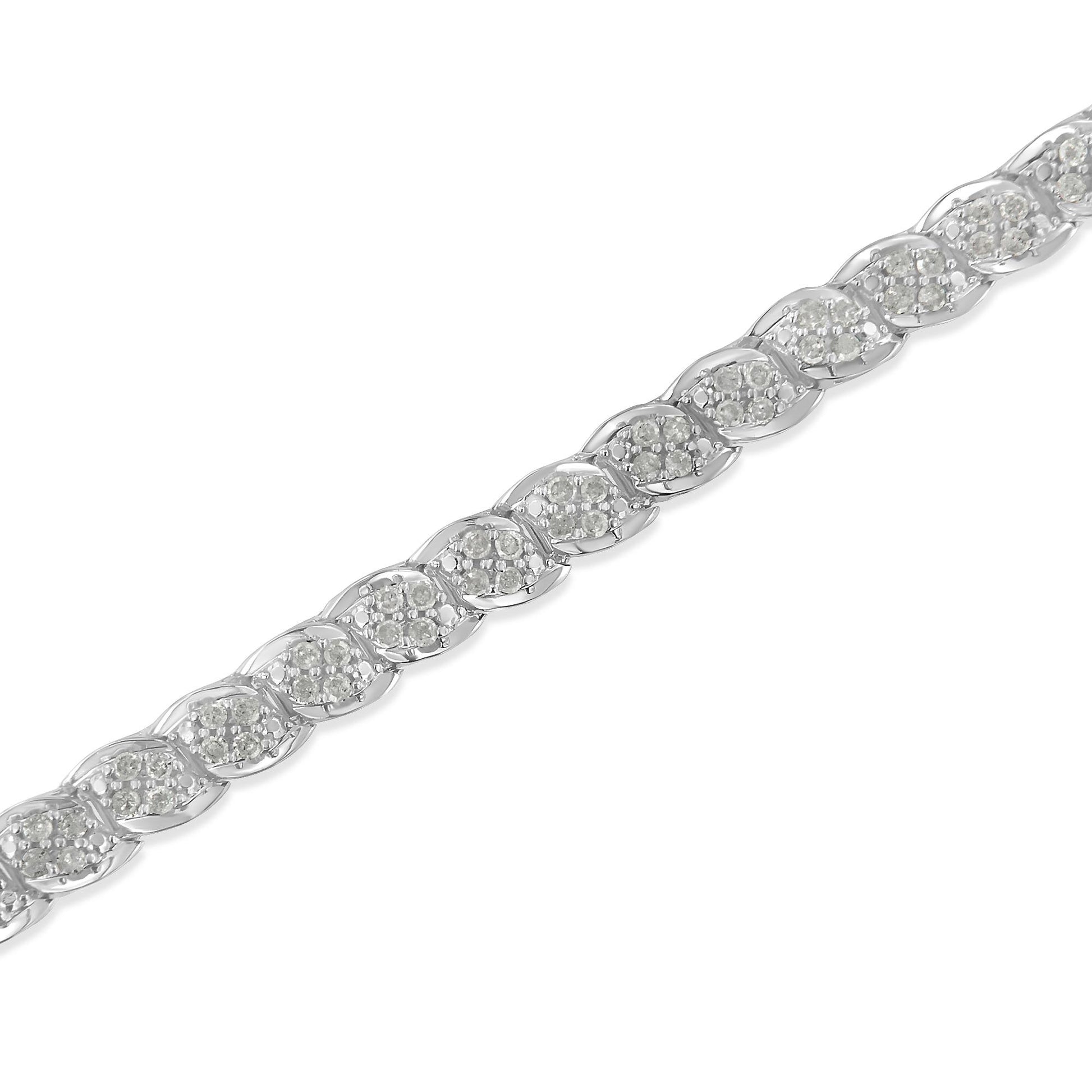 Close-up, angled top view of a white metal bracelet featuring multiple sections each set with clusters of round white gemstones in prong settings.