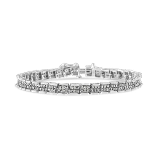 White metal bracelet with round white gemstones in pave setting, shown from a front angle on a white background.
