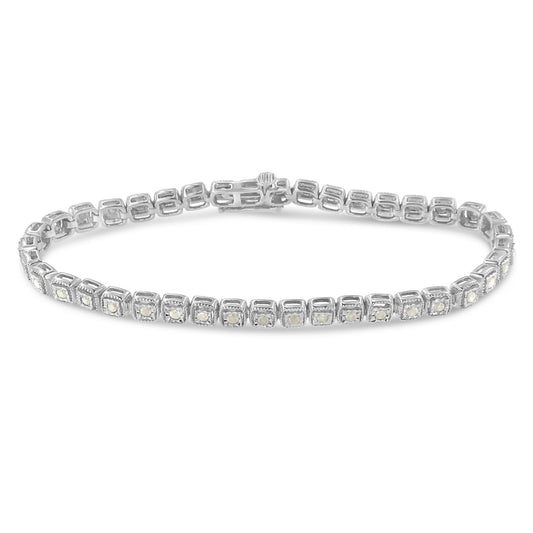 White metal bracelet with round white gemstones in a miracle setting, shown at a slight angle on a white background.