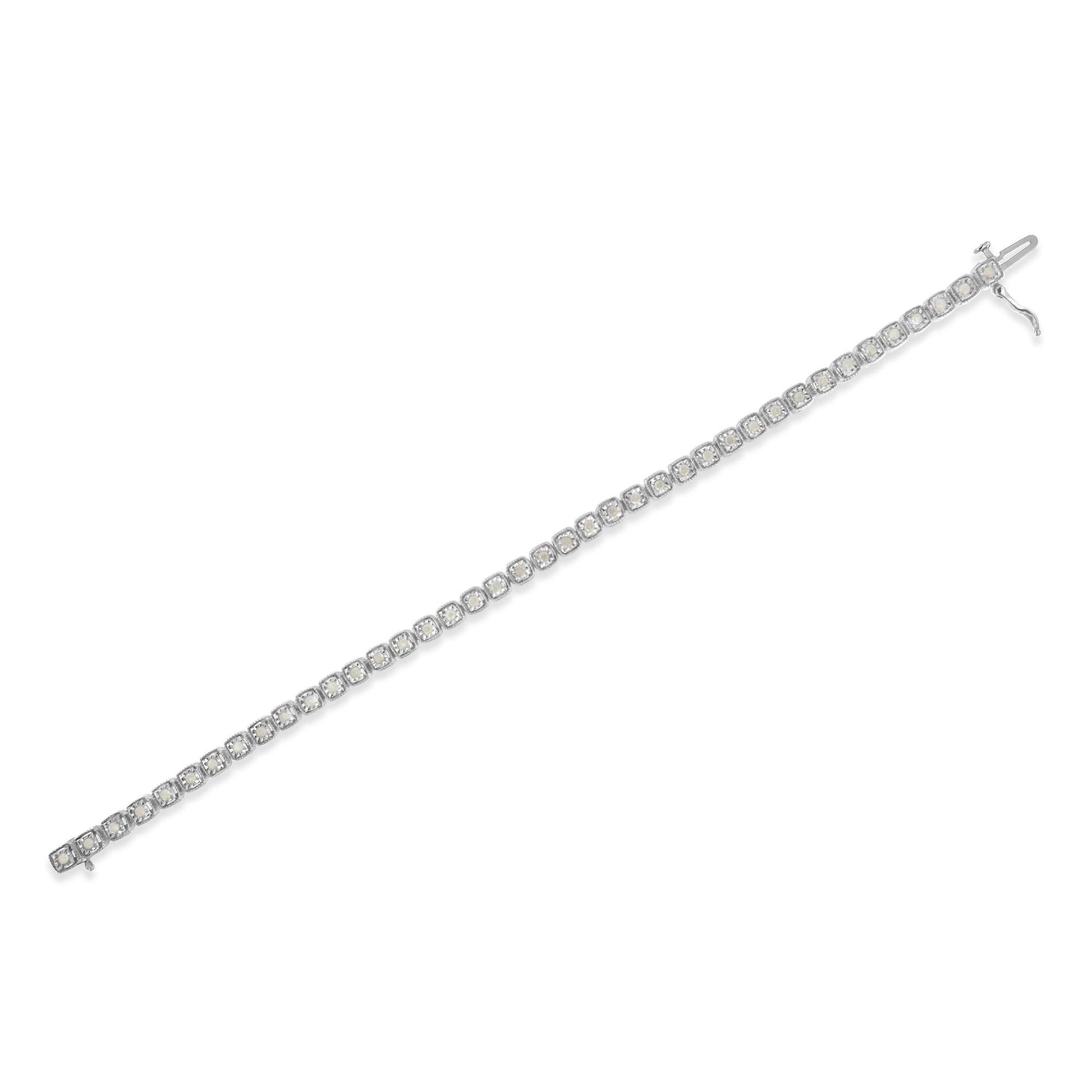 White metal bracelet with round white gemstones in miracle settings, shown laying flat in a diagonal top-down view.