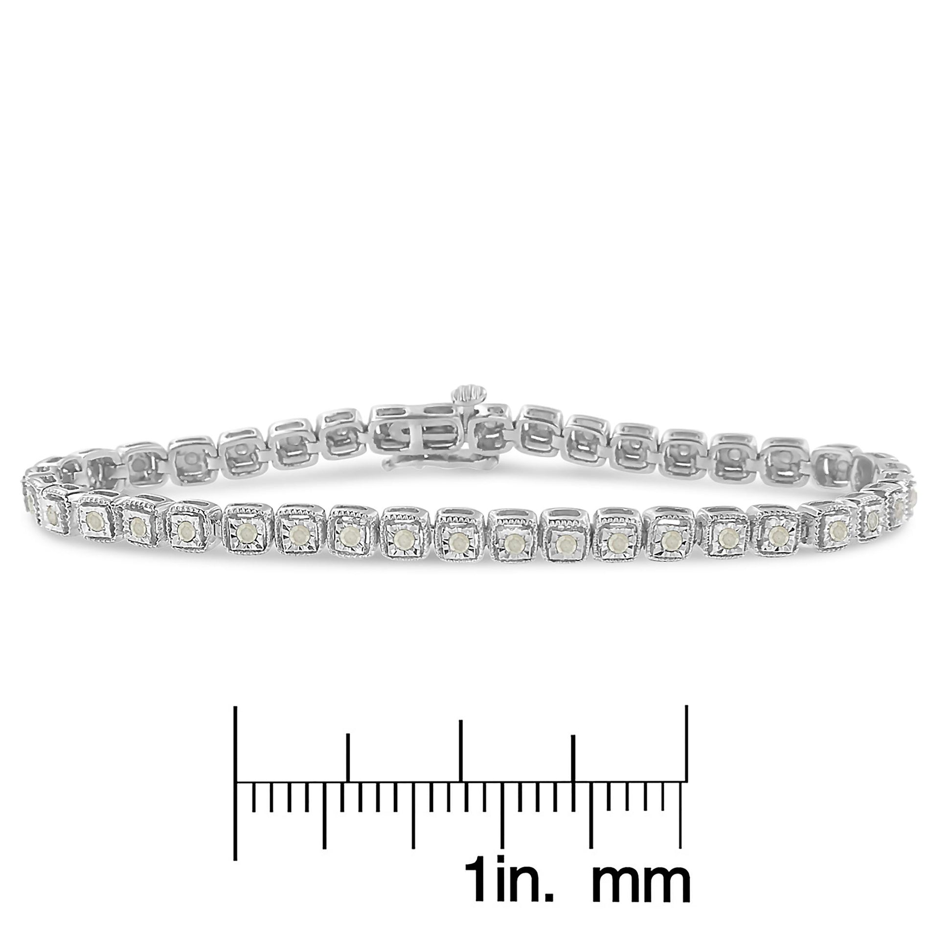 White metal bracelet with round white gemstones in square settings, shown from a front angle, placed above a ruler for size reference.