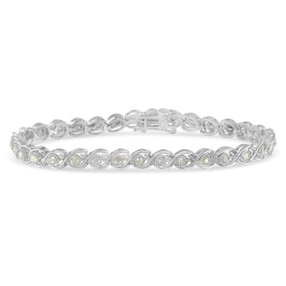 White metal bracelet with round white gemstones in a twisted pattern, shown from a side angle.