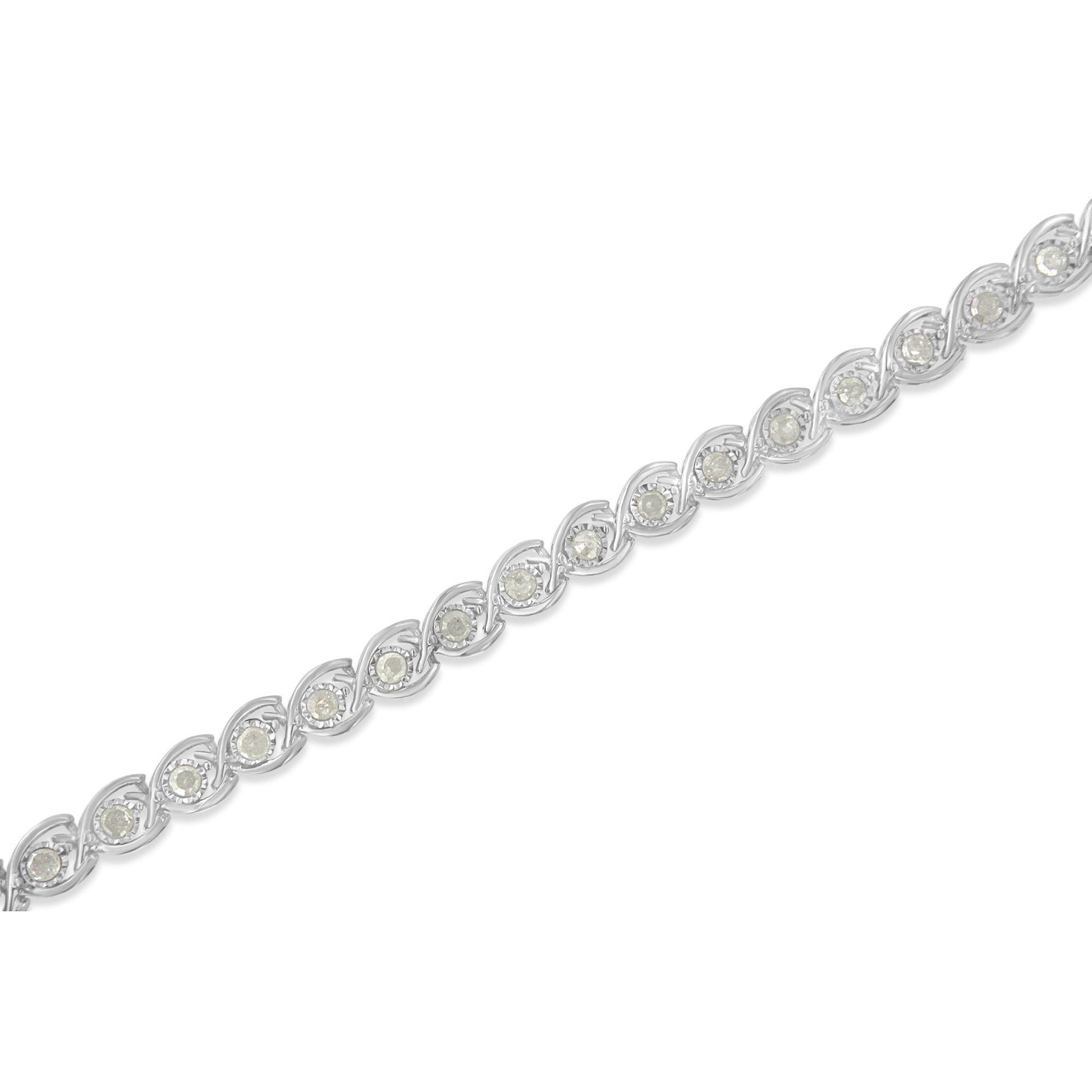 White metal bracelet with round white gemstones in miracle settings, shown in a diagonal close-up view.