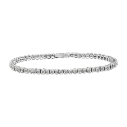 White metal bracelet with round white gemstones in a miracle setting, shown from the front angle.