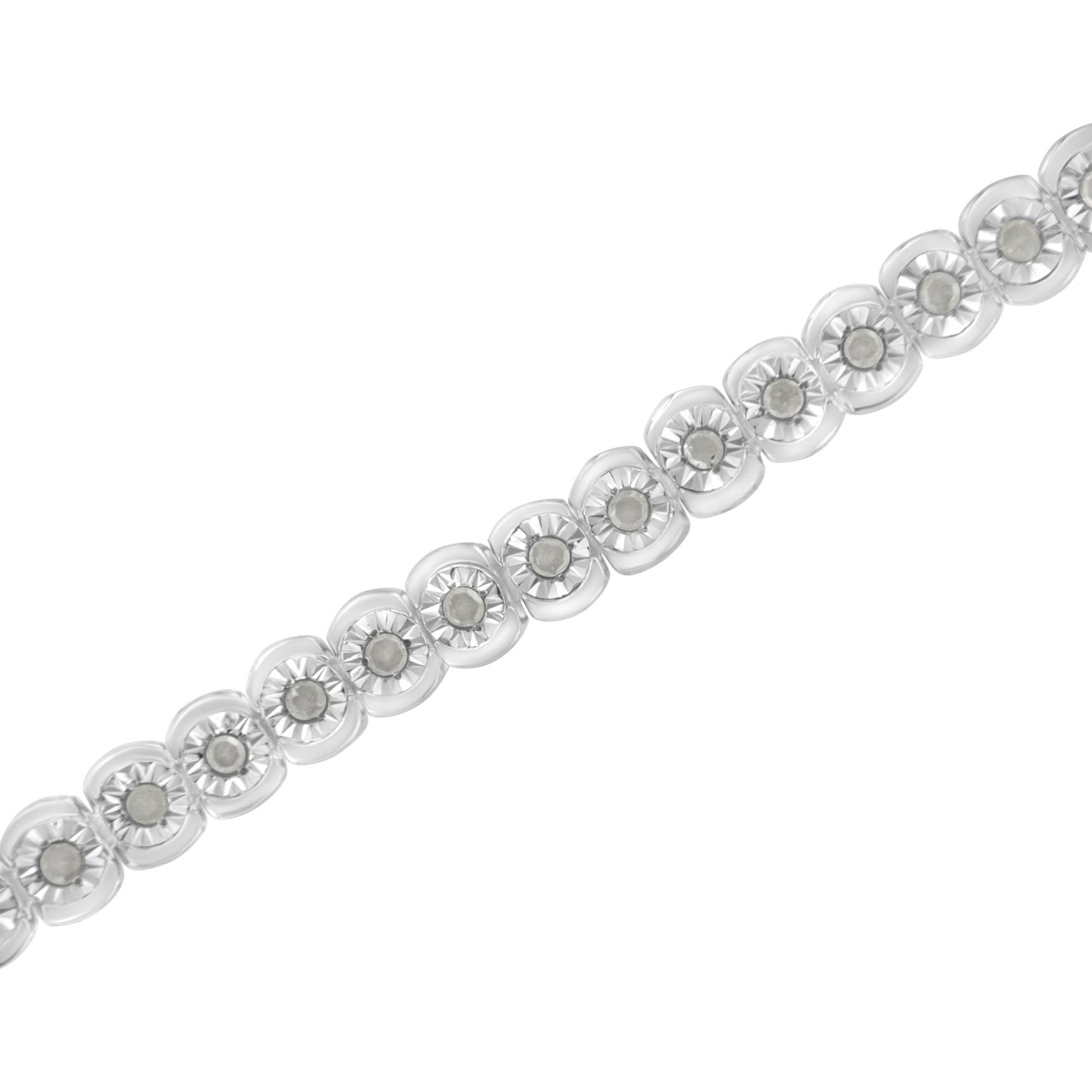White metal bracelet with round white gemstones in miracle settings, shown diagonally from a close-up top angle.