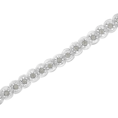 White metal bracelet with round white gemstones in miracle settings, shown diagonally from a close-up top angle.