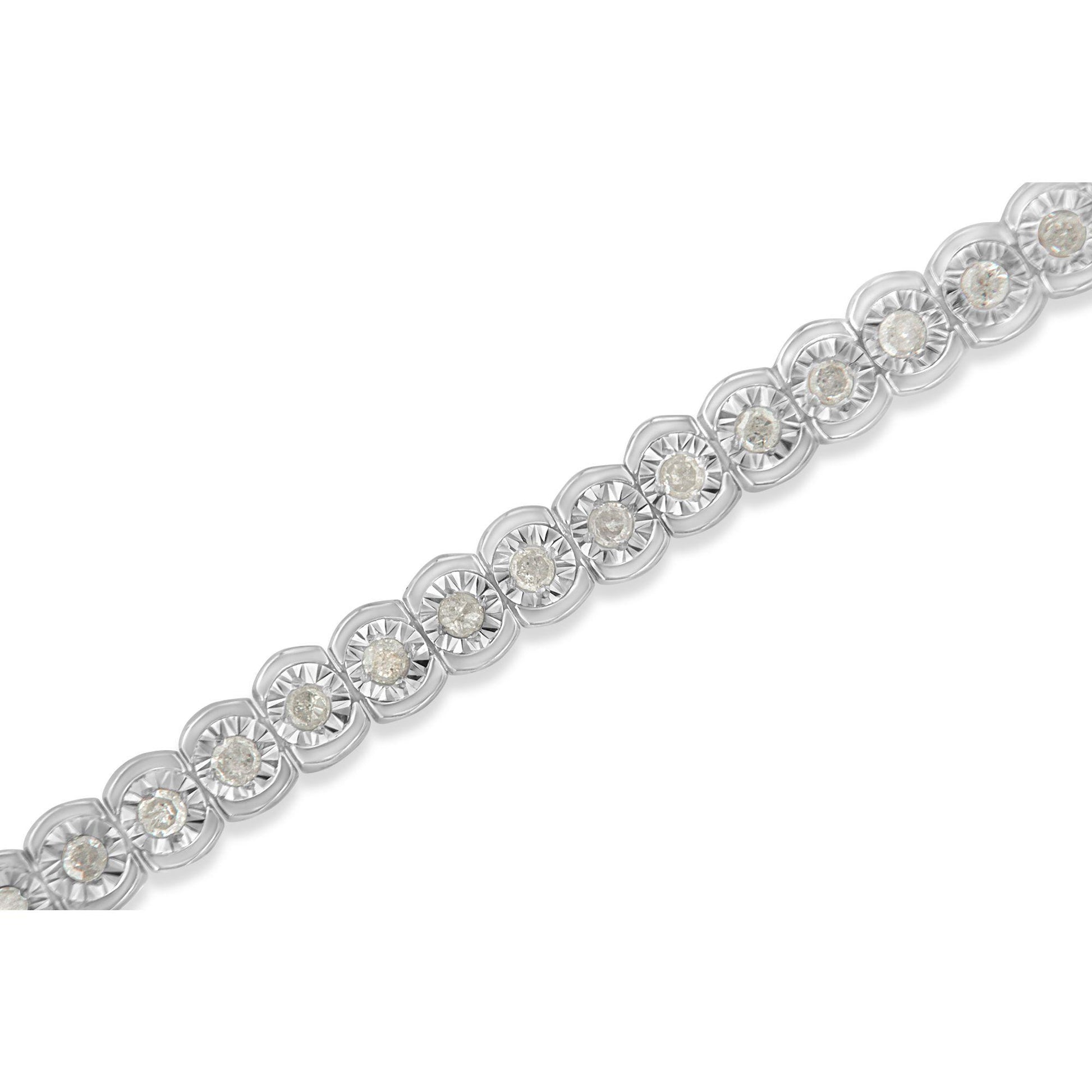 Close-up diagonal view of a white metal bracelet featuring round white gemstones in a miracle setting.