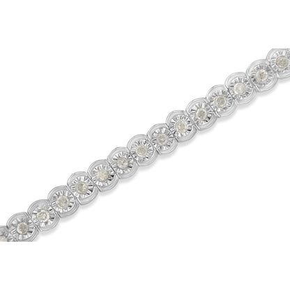 Close-up diagonal view of a white metal bracelet featuring round white gemstones in a miracle setting.