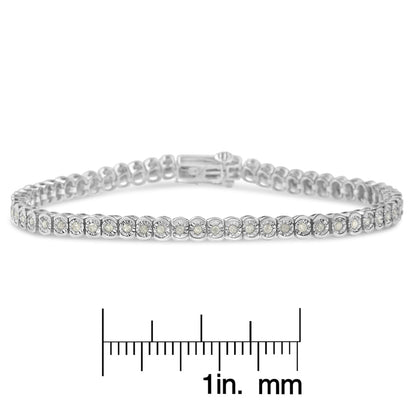 White metal bracelet with round white gemstones in miracle setting, shown from front angle on a ruler for size reference.