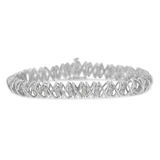 White metal bracelet with round white gemstones set in a crisscross pattern, shown from a front angle.