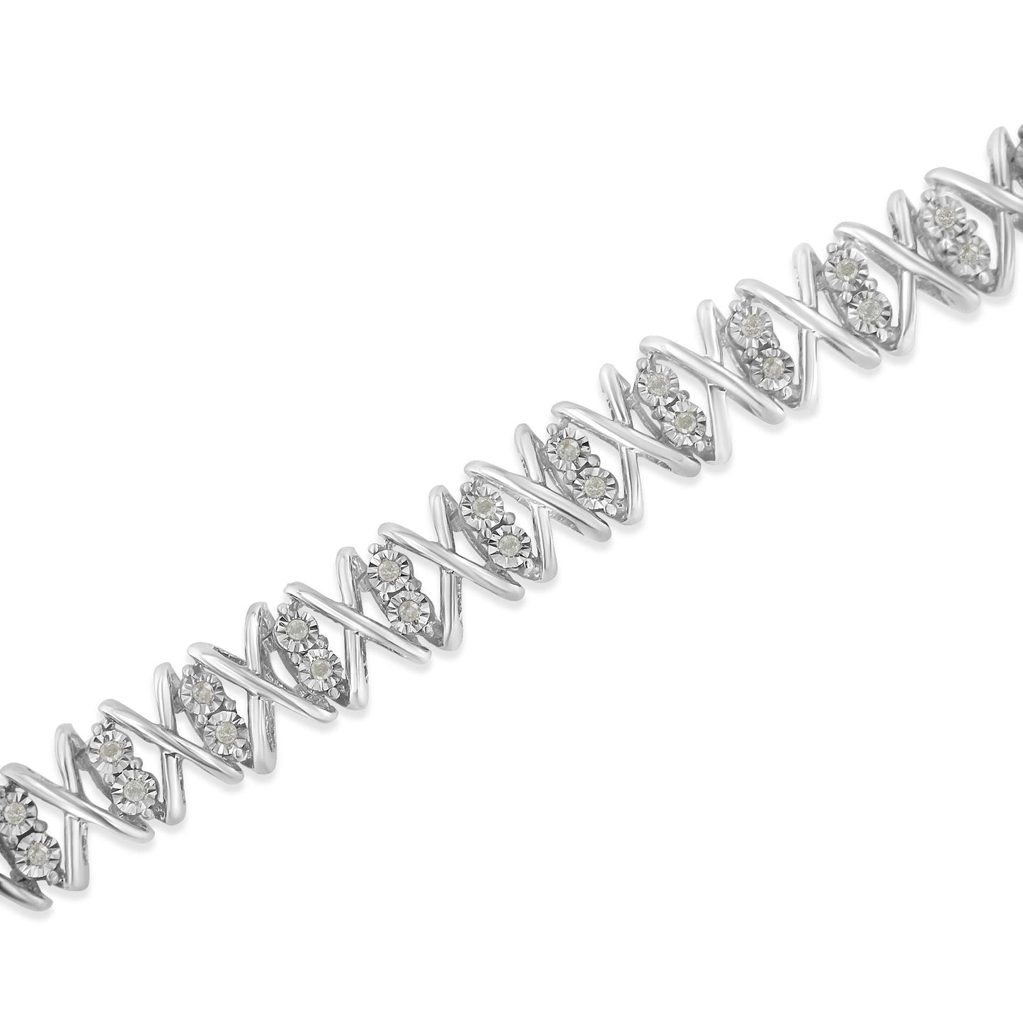 White metal bracelet with alternating zigzag links and clusters of round white gemstones, shown in a diagonal close-up angle.