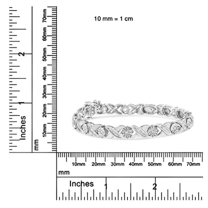 White metal bracelet with alternating round and baguette-shaped white gemstones in Miracle and channel settings, pictured on a corner ruler for size reference, shown from a front angle.