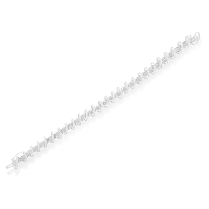 White metal bracelet with round white gemstones set in miracle and prong settings, shown from a top diagonal angle on a white background.