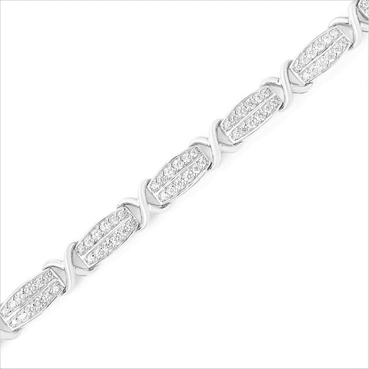 Diagonal close-up of a white bracelet featuring alternating rectangular links with pave-set round white gemstones and smooth curved links.