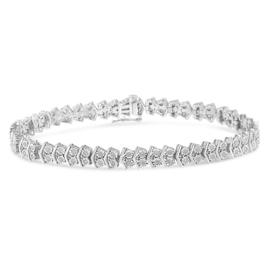 White metal bracelet with round white gemstones in a miracle setting, shown at an angled side view.