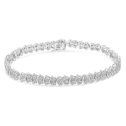 Close-up, front angle of a white metal bracelet with round white gemstones in a miracle setting along its length.