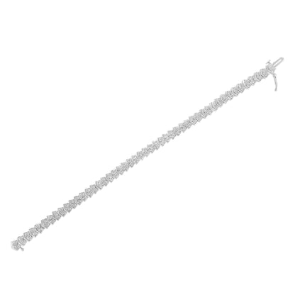 White bracelet with round white gemstones in a miracle setting, shown in a flat lay from a top angle.