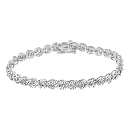 White metal bracelet with round white gemstones in a miracle setting, shown in a slightly angled top-down view.