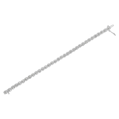 White metal bracelet shown from above, featuring a linear design of round white gemstones set in a miracle setting, with a clasp closure visible on one end.