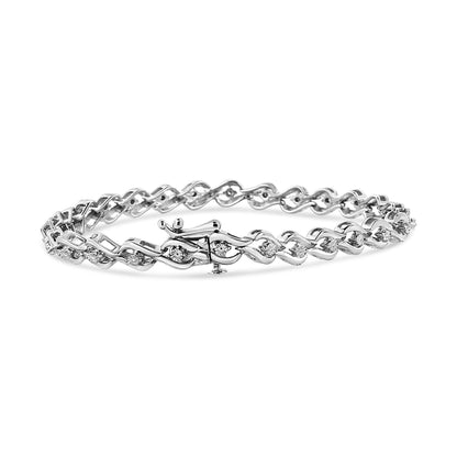 White metal bracelet with round white gemstones in a miracle setting, shown in a side view.