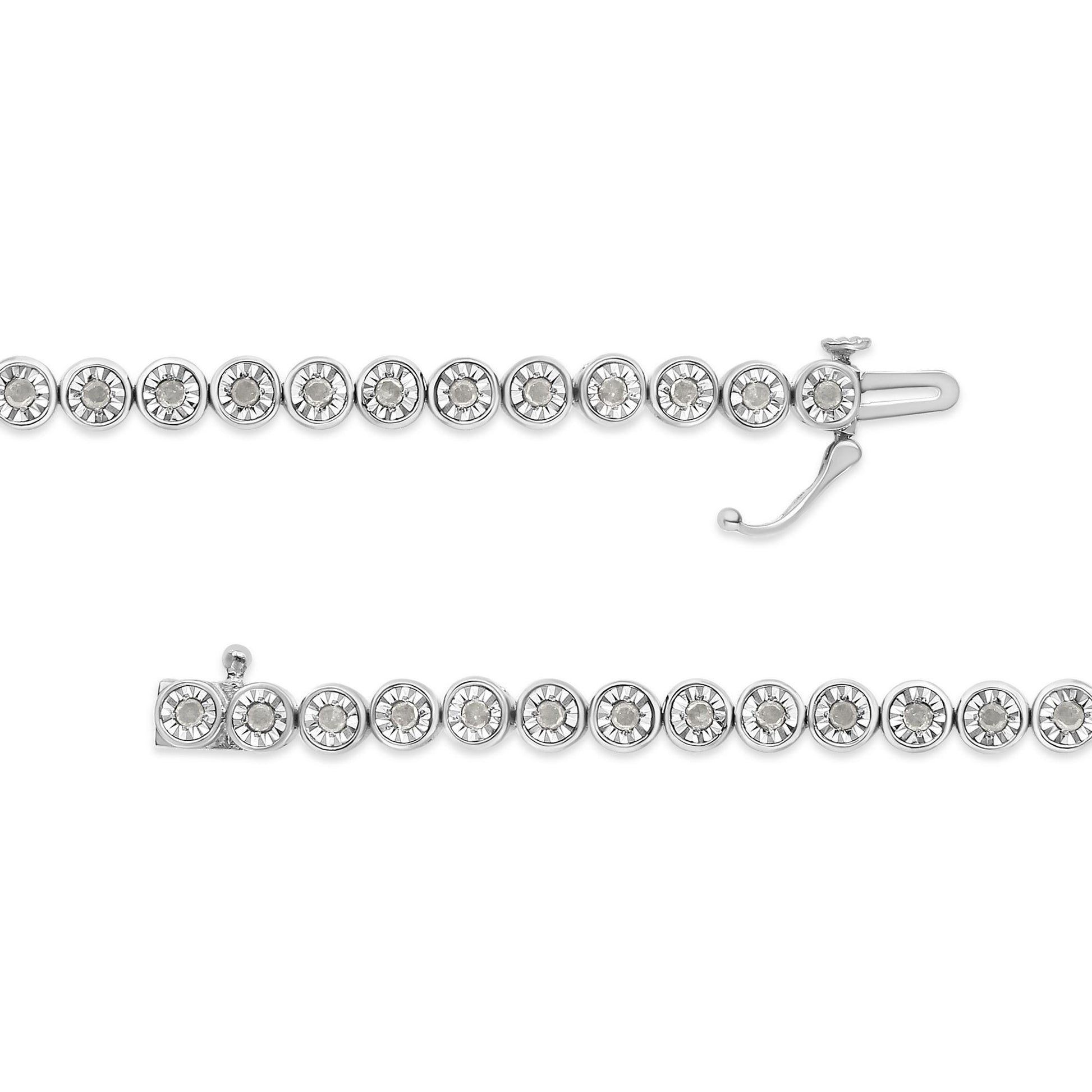 Top-down view of a white metal bracelet with round white gemstones set in a continuous line, shown with clasp open.